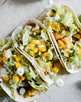 Beer Battered Fish Tacos with Margarita Mango Salsa and Jalapeno Crema